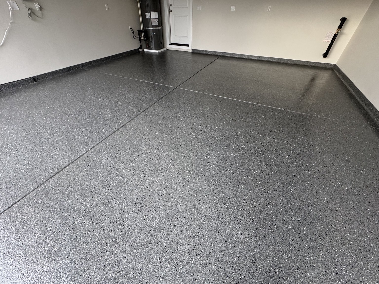 AM Hardscape gray flake epoxy garage floor with coated perimeter